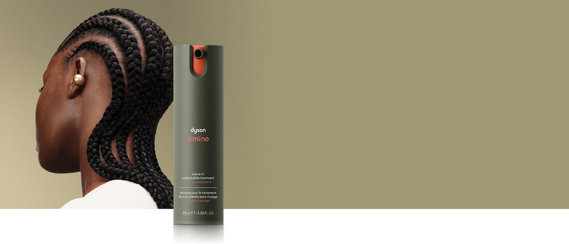 Dyson Amino leave-in scalp bubble treatment in front of a model.