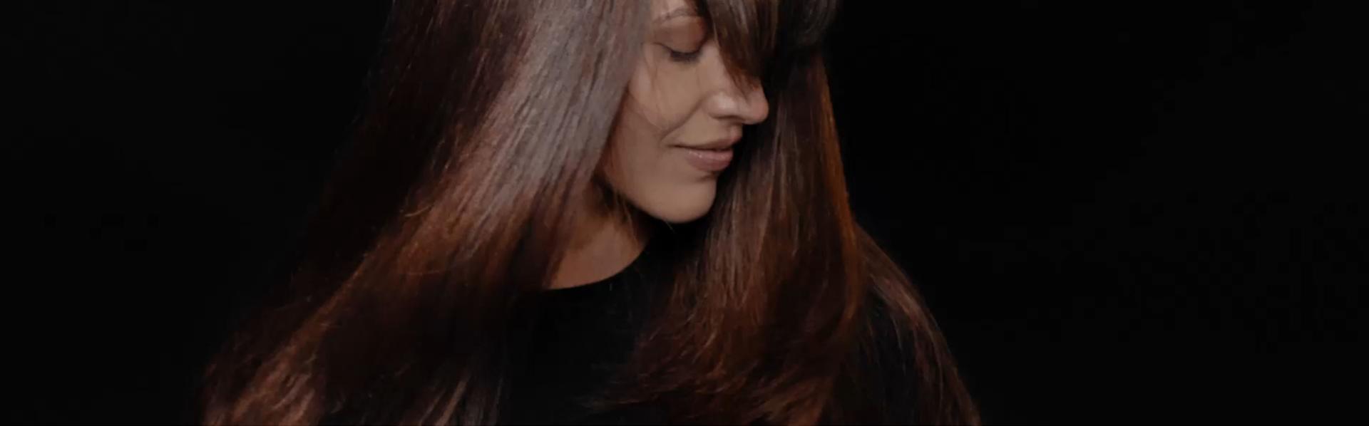 A model shows off her hair styled with Dyson Chitosan products.