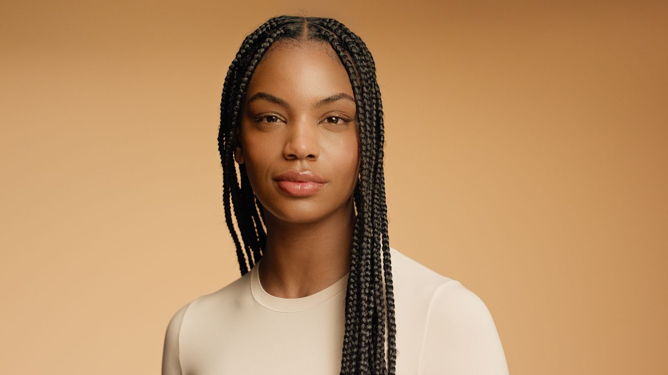 A model with naturally coily hair in a protective style nourished with the Dyson Omega collection. A model with naturally coily hair in a protective style nourished with the Dyson Omega range.