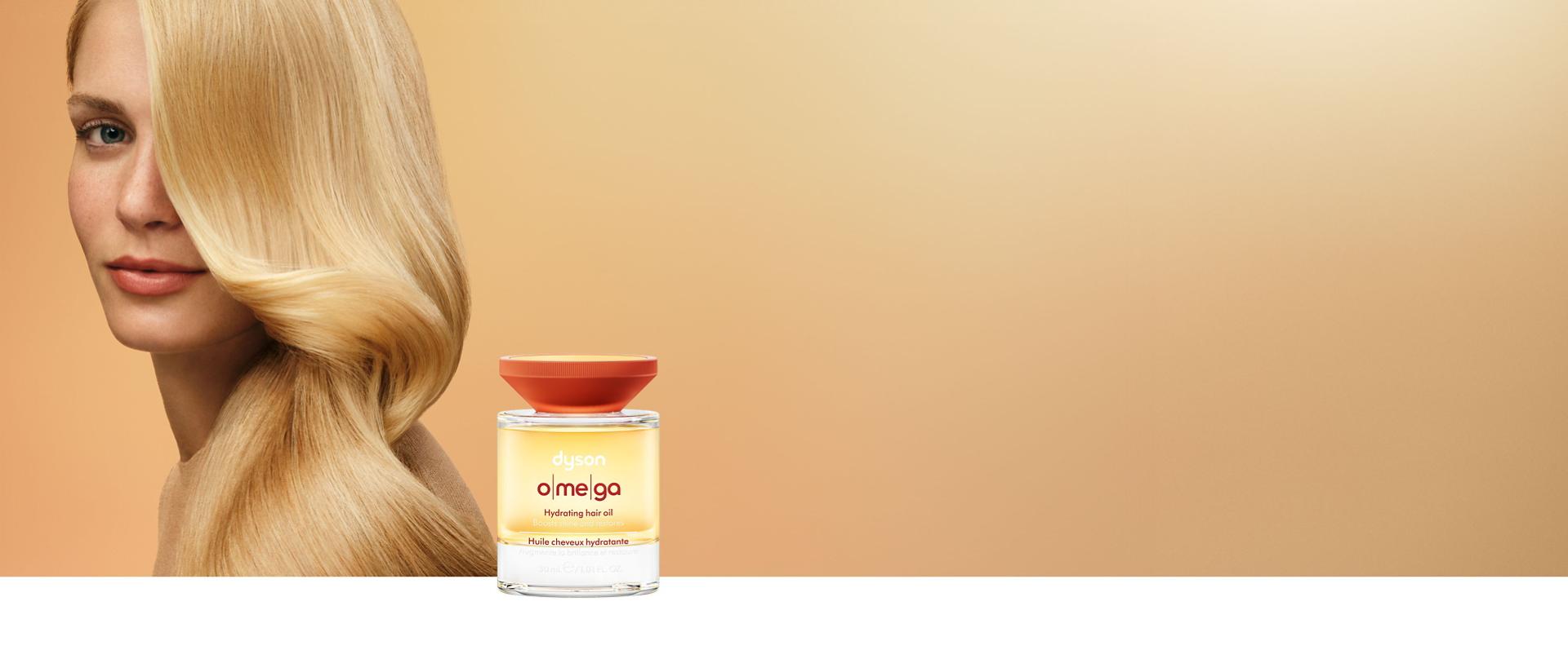 A blonde model behind the Dyson Omega nourishing range.