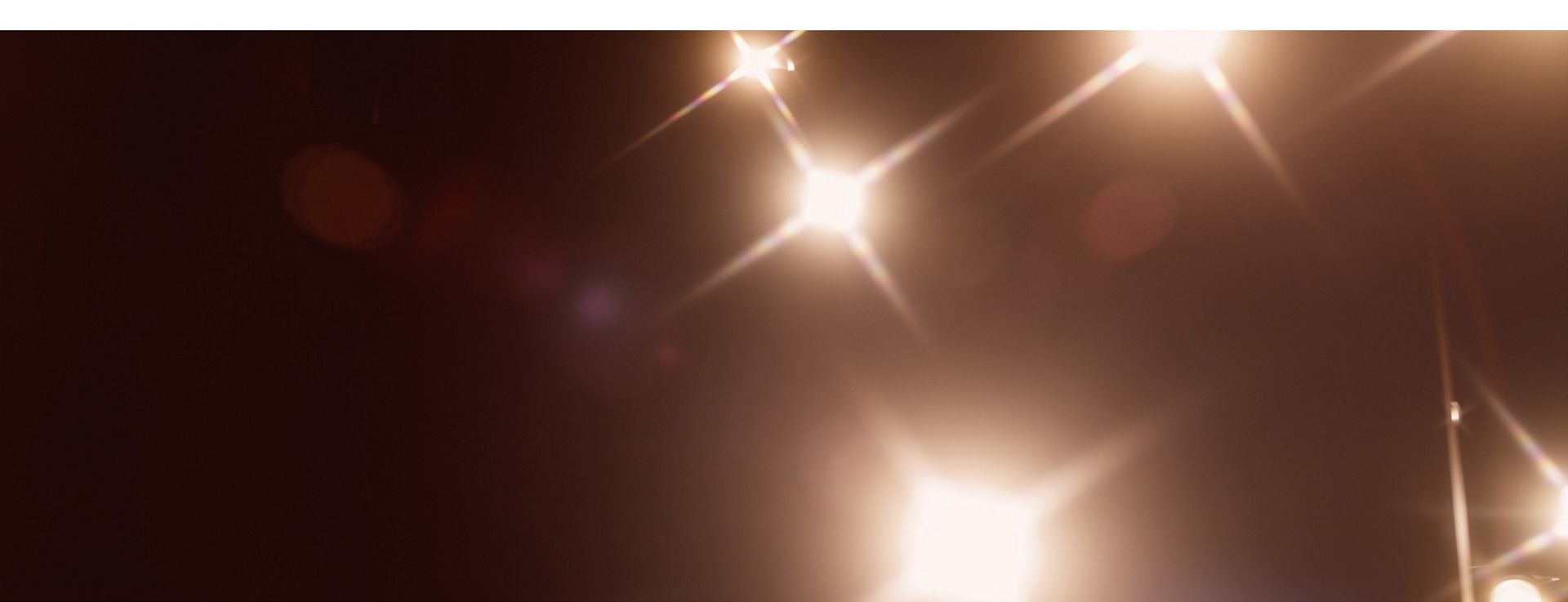 Glistening lights on a dark background.