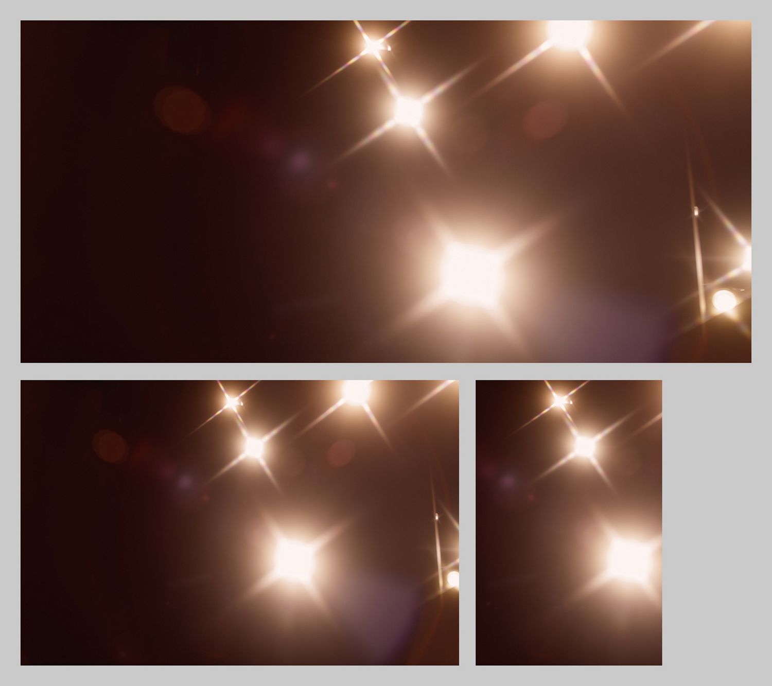 Glimmering lights with lens flares on a dark background.