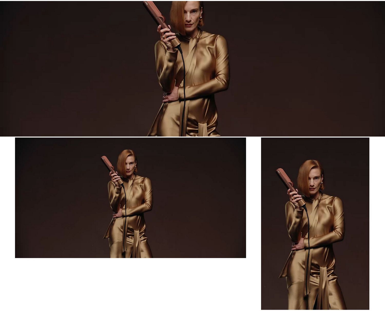 Model holds a Dyson hair care device in front of them.