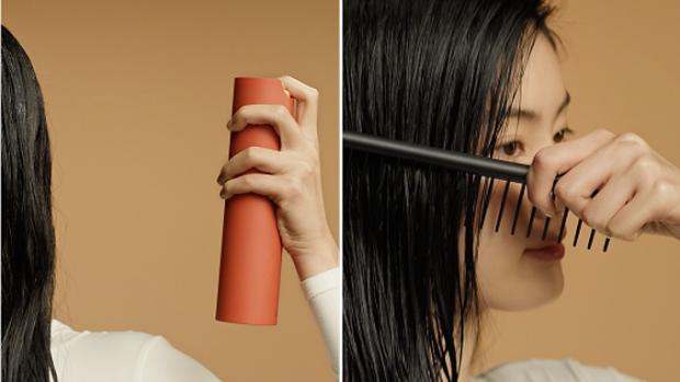 The Dyson Omega leave-in conditioning spray dispenses a fine mist onto hair and is then combed through.