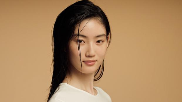 A model with damp, towel-dried hair.