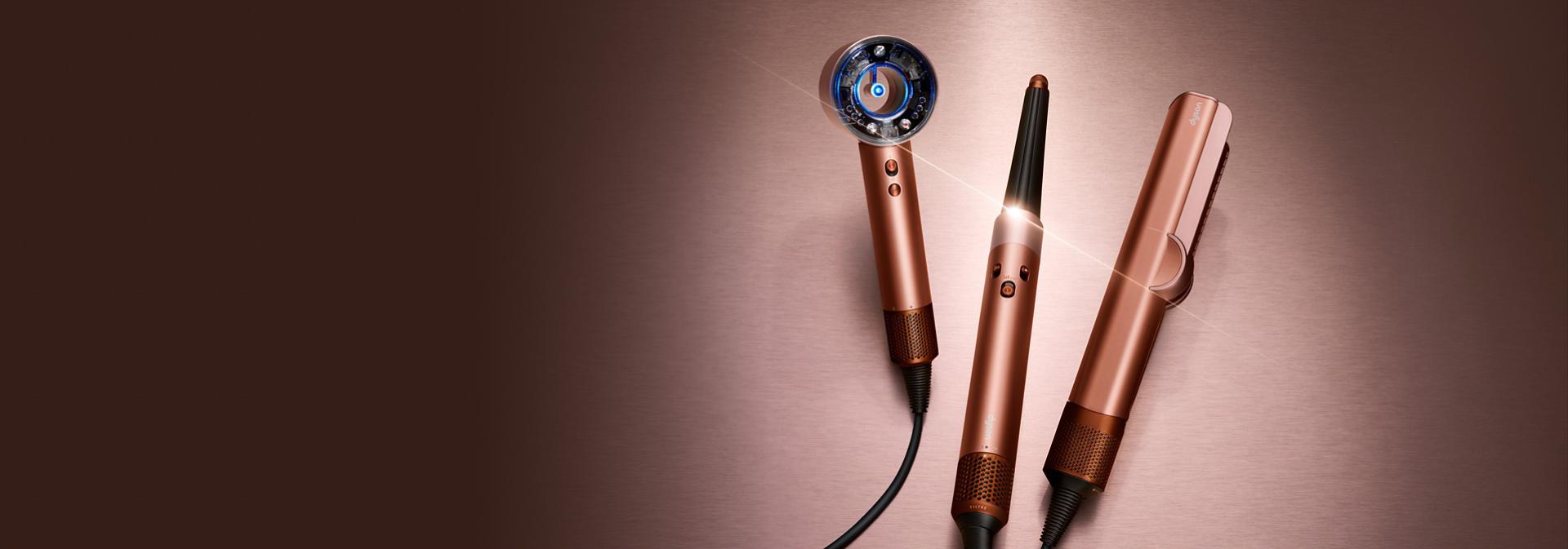 The Dyson Beauty device range in Amber silk colourway.