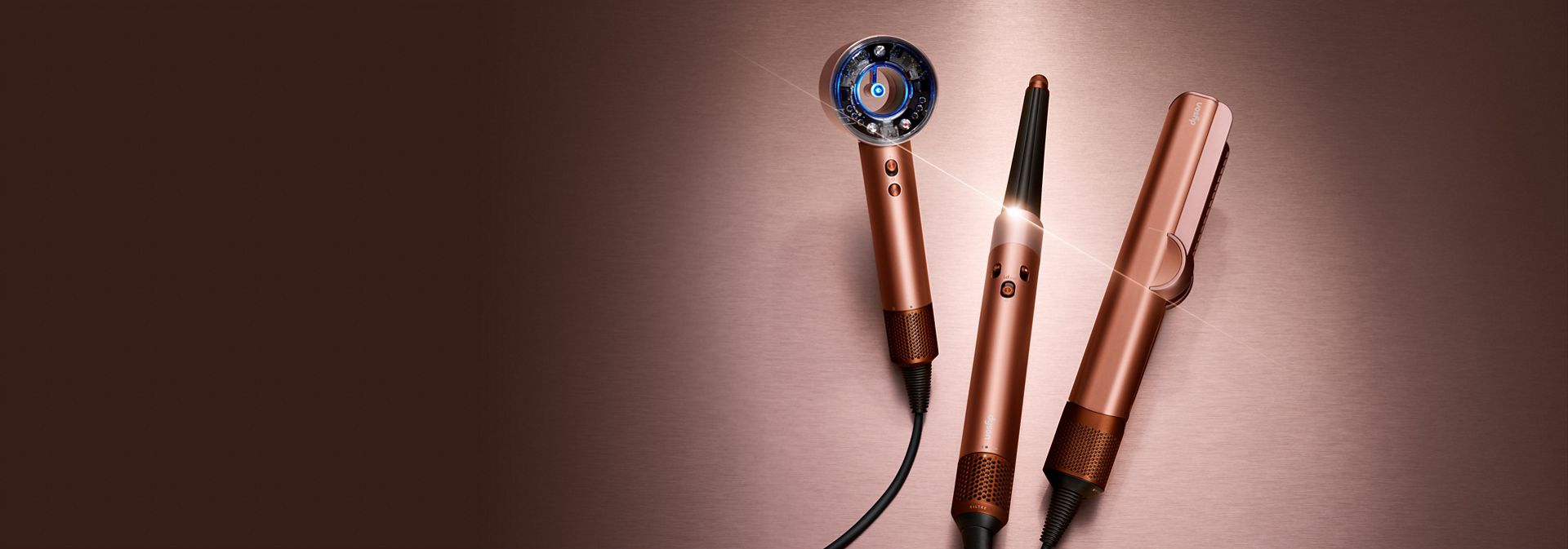 The Dyson Beauty device range in Amber silk colourway.