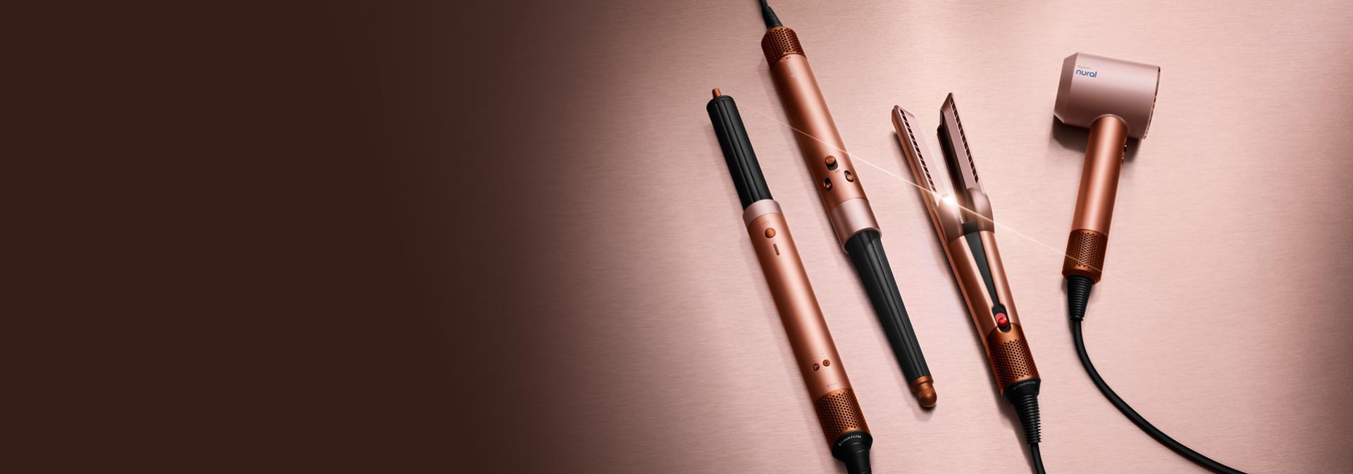 The Dyson Beauty device range in Amber silk colourway.