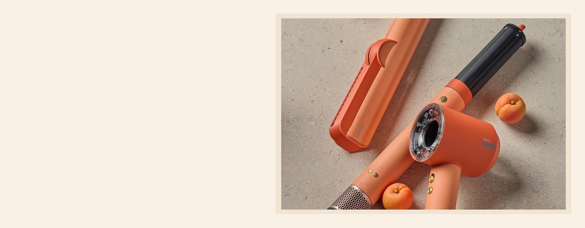 Dyson Beauty devices in the new Ceramic apricot colourway.