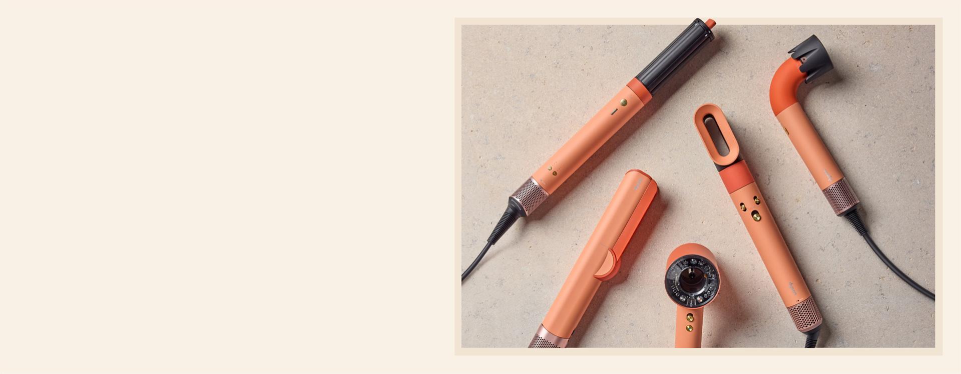 Dyson Beauty devices in the new Ceramic apricot colourway.