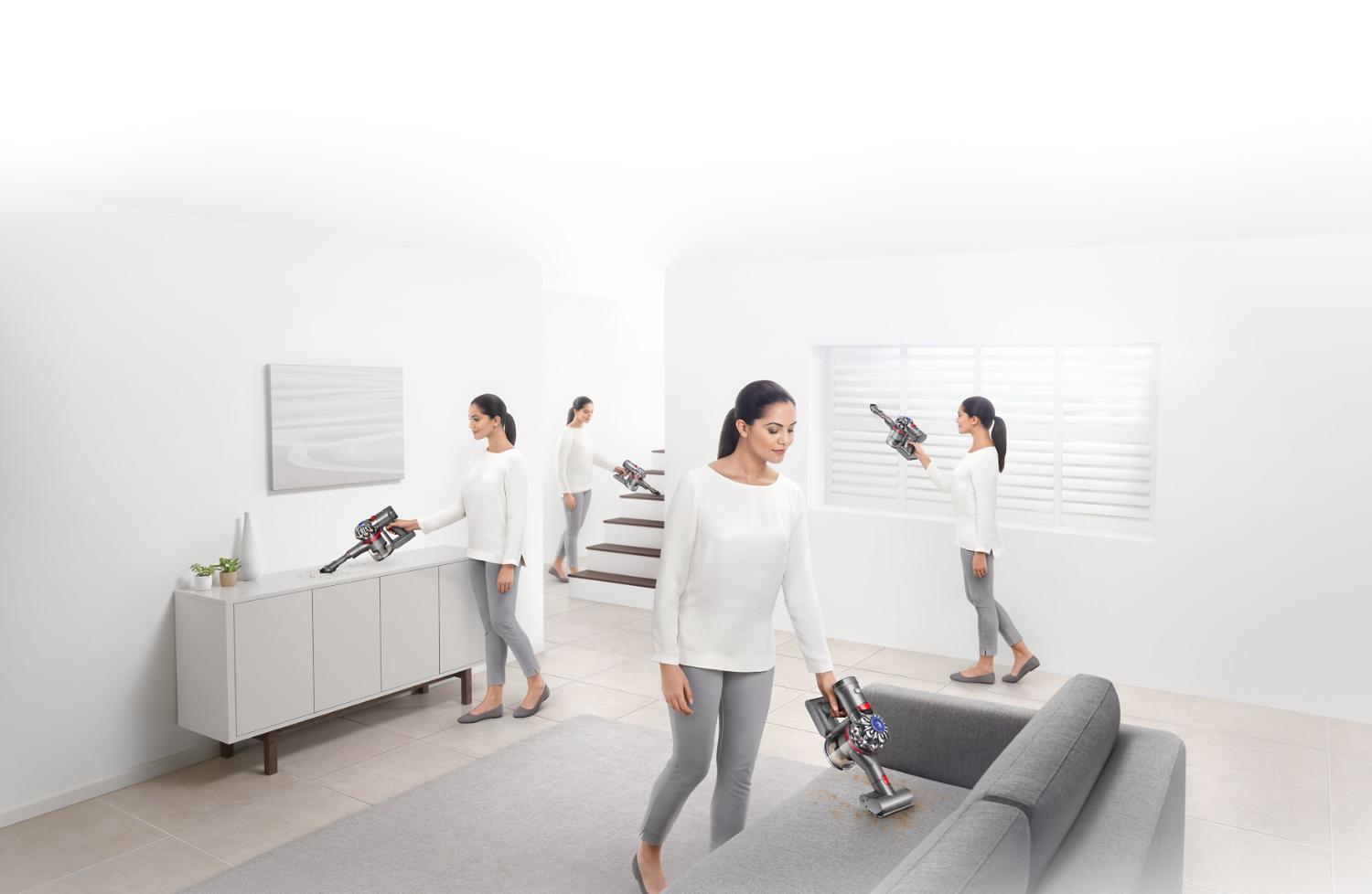 Model using Dyson V7™ handheld vacuum