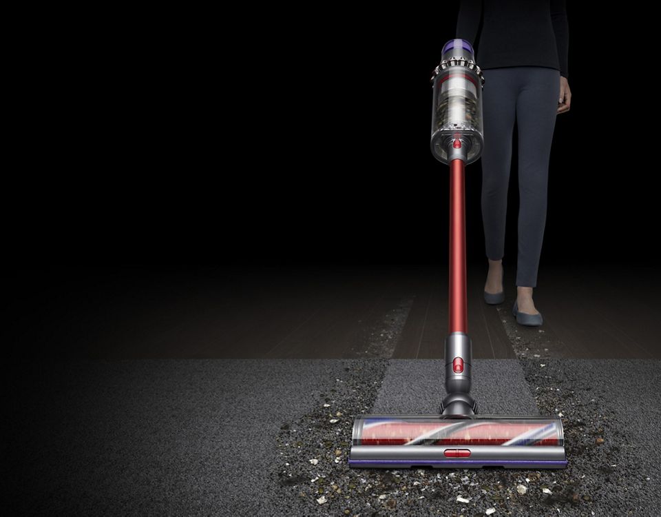   Dyson Outsize vacuum front view cleaning carpet