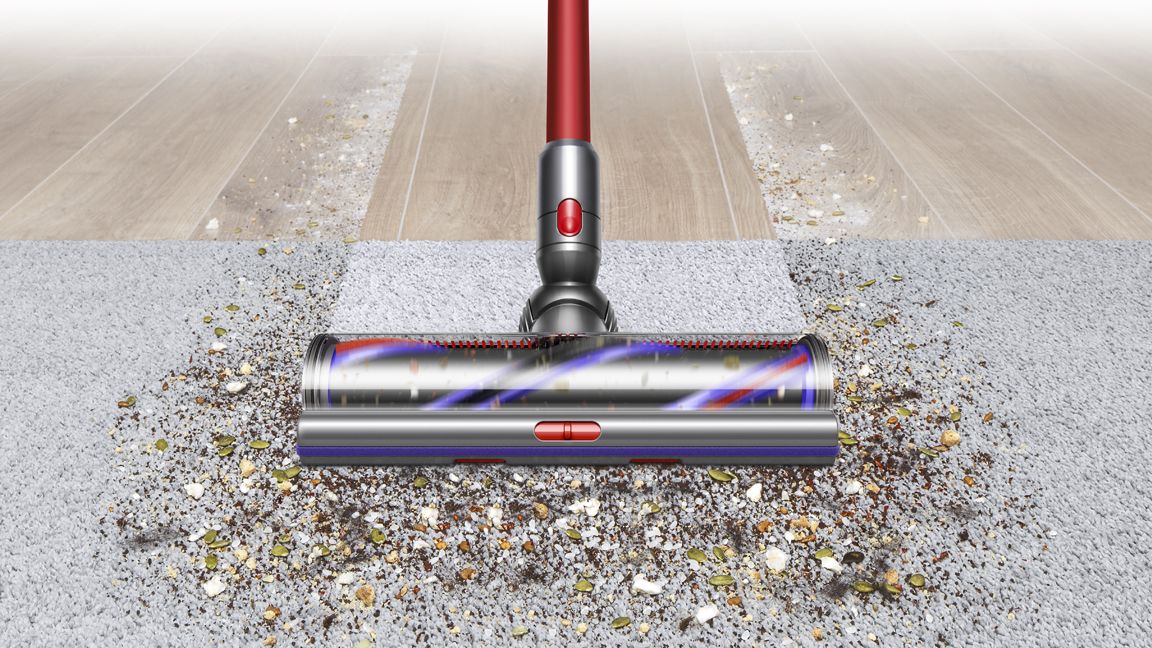The Dyson Outsize+ vacuum cleaning a carpet