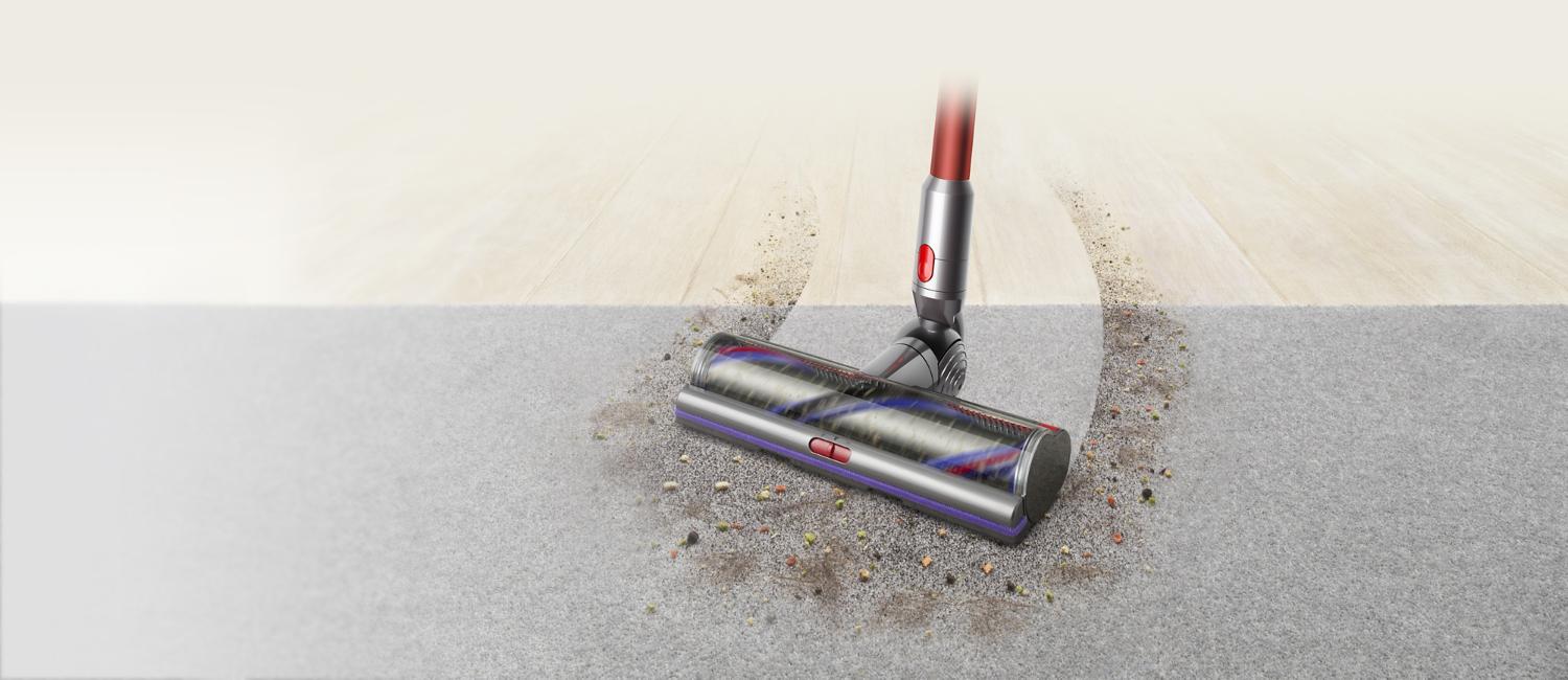 Cleaner head moving from hard floor to carpet