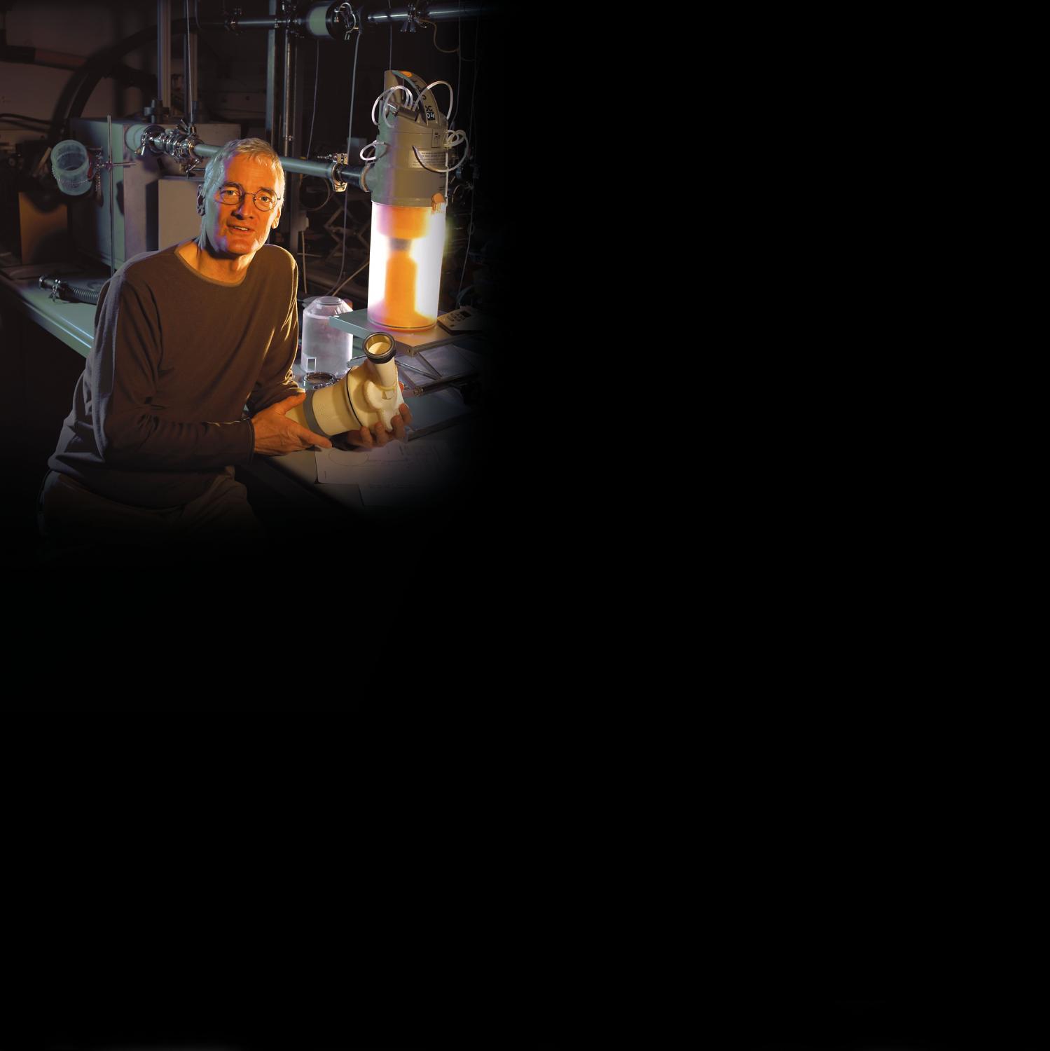 James Dyson with early Dyson vacuum cleaner
