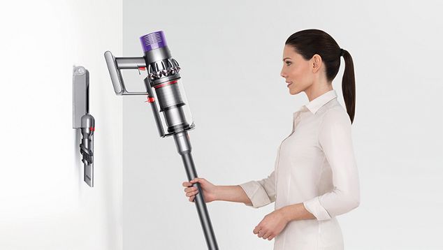 Dyson Cyclone V10 being placed onto docking station