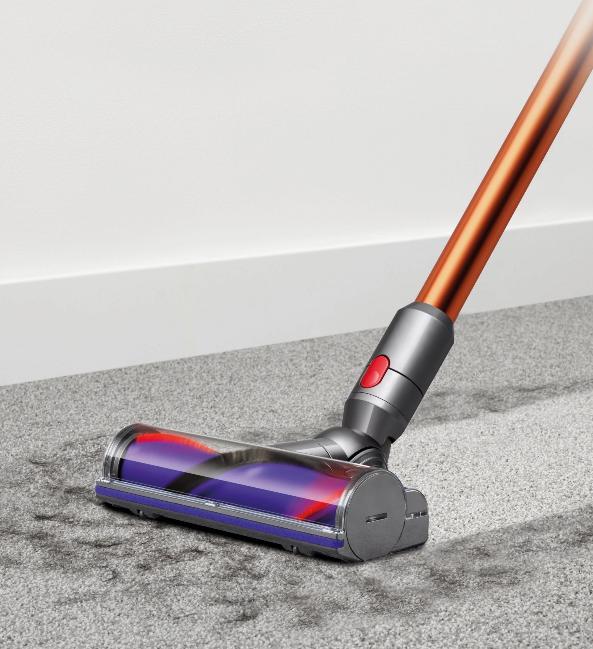 Dyson Cyclone V10 Direct drive cleaner head picking up debris from carpet