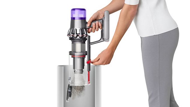 Dyson V11™ cordless vacuum emptying into bin