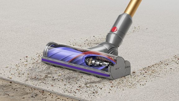 Dyson V12 Detect Slim vacuum with Slim Fluffy Laser cleaner head, showing sizes of dust detected