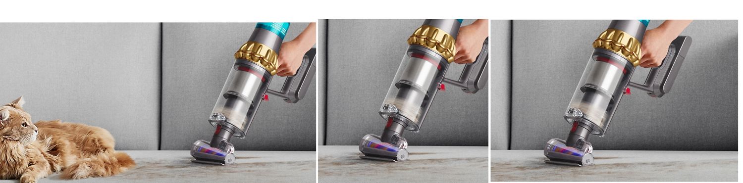 Dyson V15s with Hair screw tool in handheld mode removes fur from a sofa while a cat sits nearby. Dyson V15s with Hair screw tool in handheld mode removes fur from a sofa while a cat sits nearby.