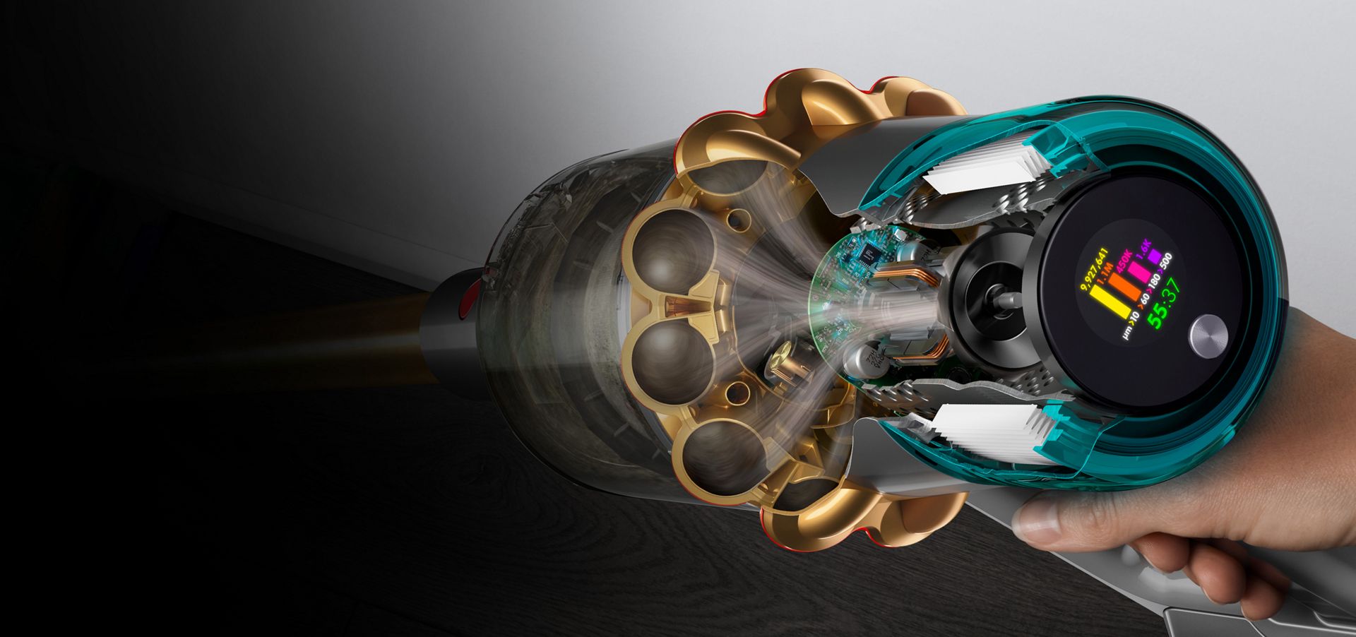 A cutaway of the side of a Dyson V15s showing debris being filtered with the LCD user screen displaying the run time and particle counts.