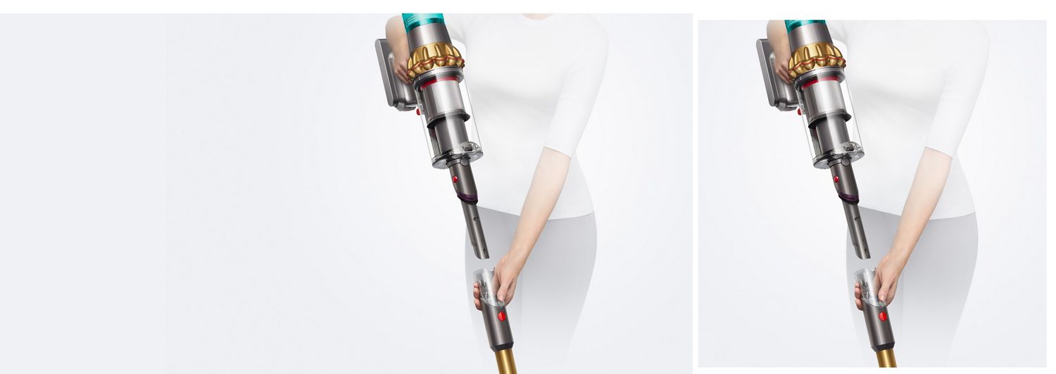 A woman holding the Dyson V15s main body high in one hand while removing the wand with the other revealing the ready-to-go crevice tool. A woman holding the Dyson V15s main body high in one hand while removing the wand with the other revealing the ready-to-go crevice tool.
