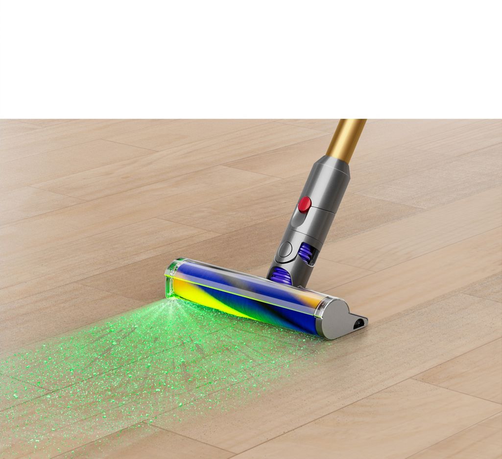 Green light emitting from the Fluffy Optic cleaner head on a laminate floor.
