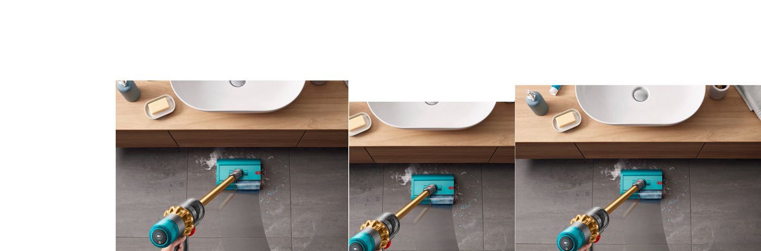 Dyson V15s Detect Submarine wet roller head cleaning a tiled bathroom floor. Dyson V15s Detect Submarine wet roller head cleaning a tiled bathroom floor from soapy water and toothpaste with a basin located to the front.