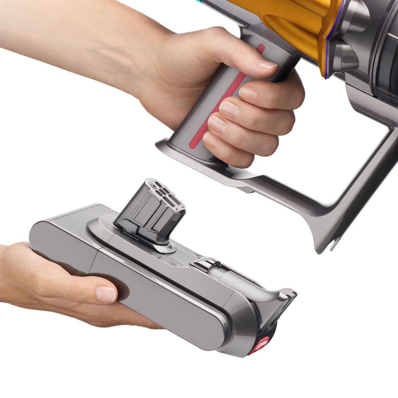 A hand is holding the V15s in one hand and the battery pack in the other hand. V15s click-in battery pack