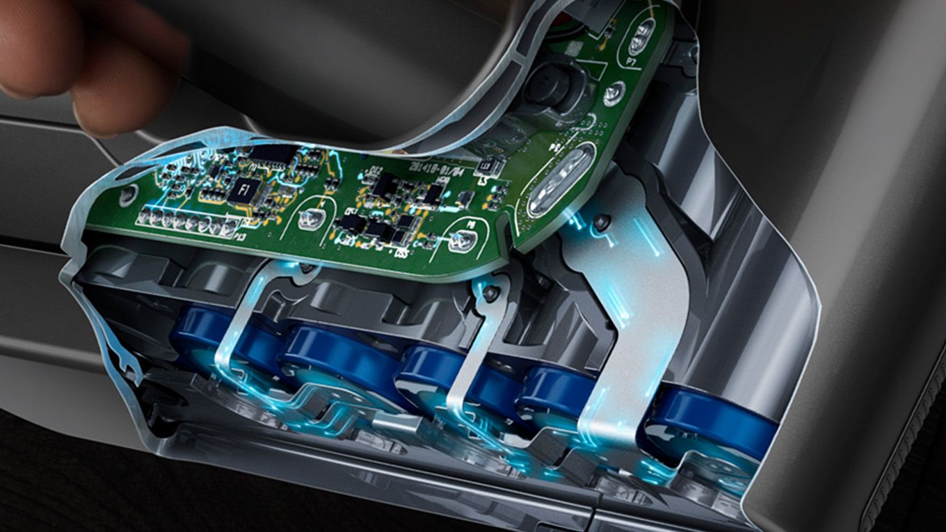 The battery pack has been cut away to reveal the cells and PCB inside. The battery pack showing the cells and PCB inside.
