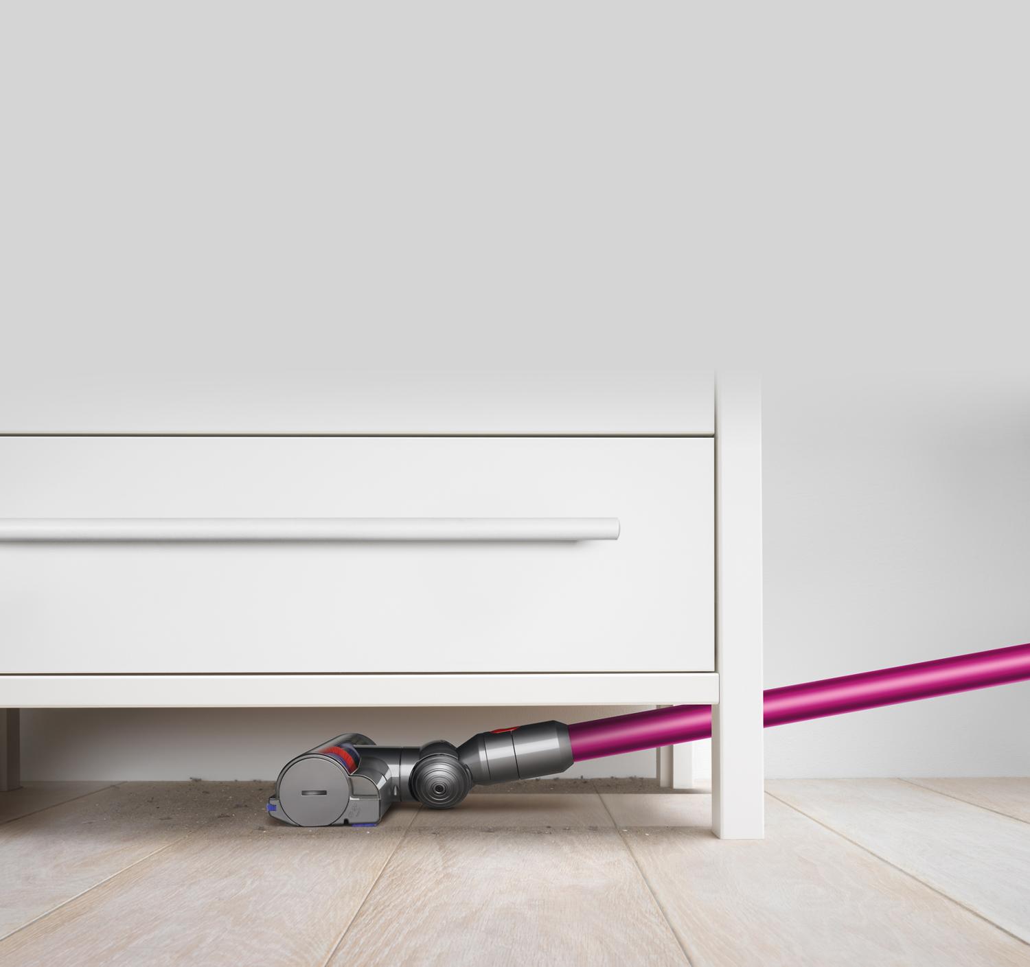 Dyson vacuum beneath furniture