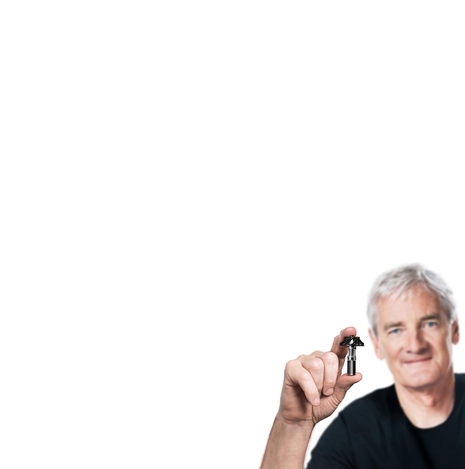 James Dyson holding Dyson digital motor