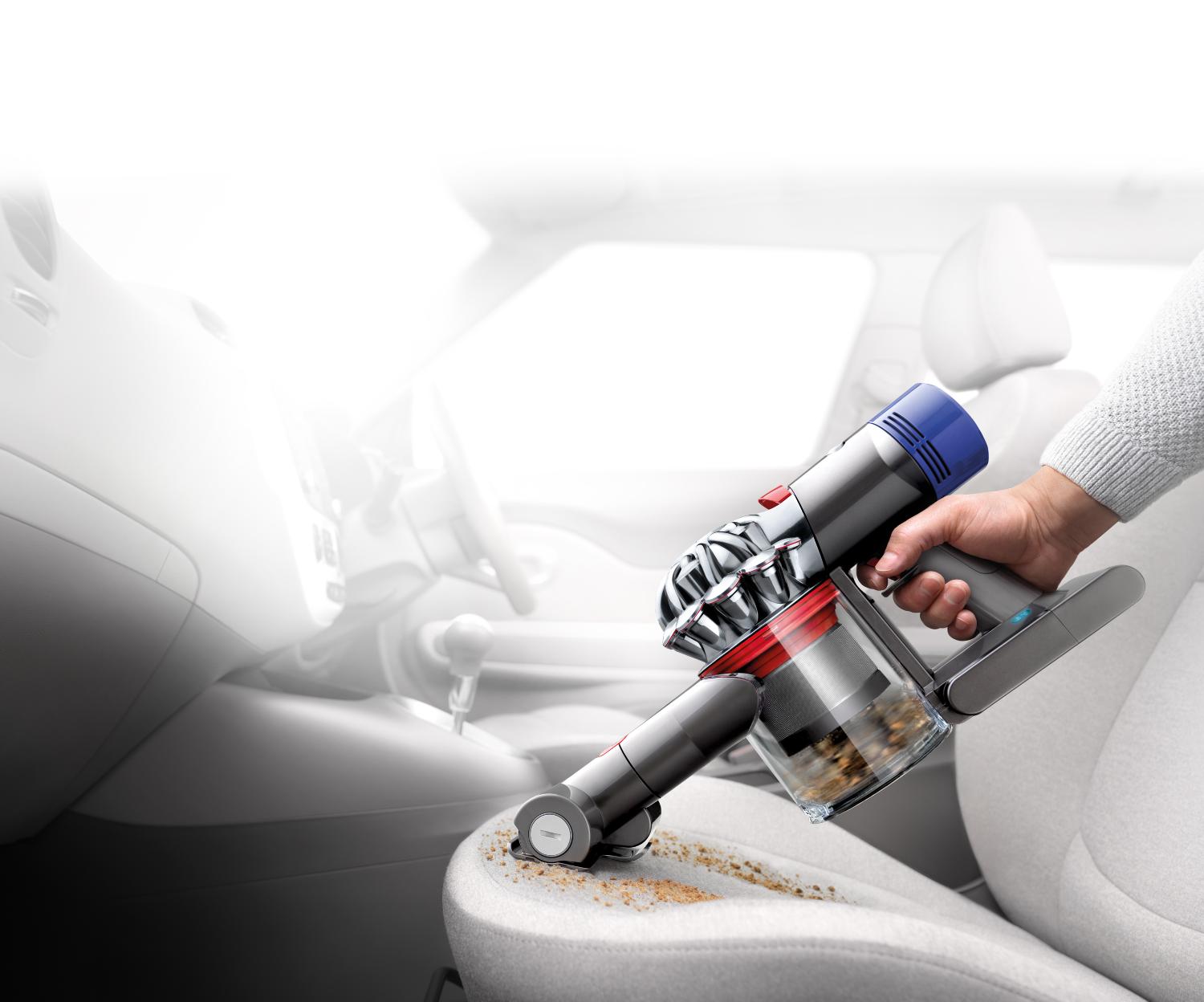Dyson V8™ vacuum on a car seat