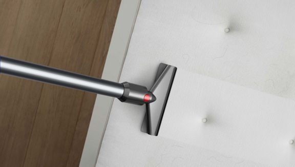Dyson V10 Alllergy cordless vacuum with mattress tool.