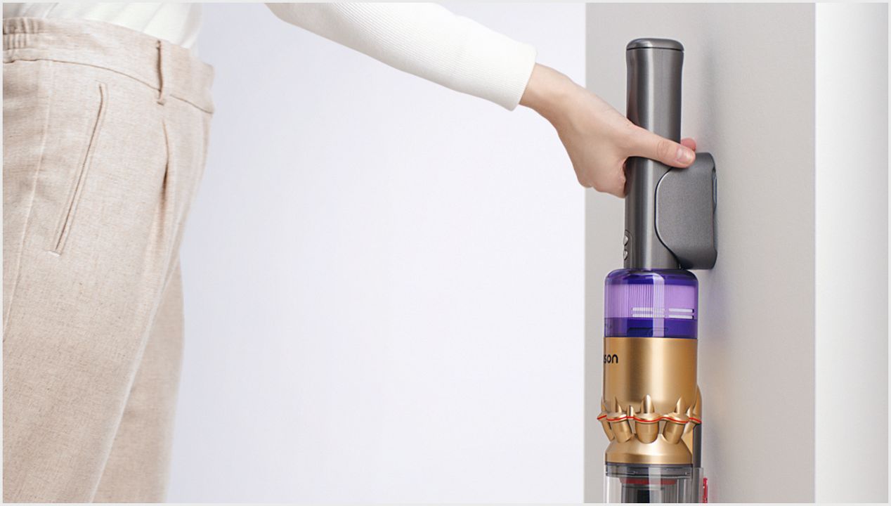 The Dyson Omni-glide vacuum in its wall dock