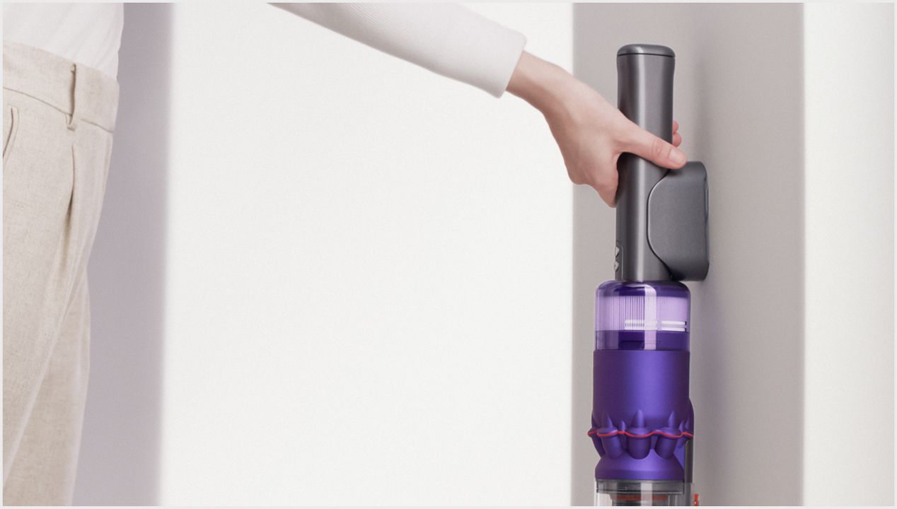 Dyson Omni-glide vacuum in its wall dock