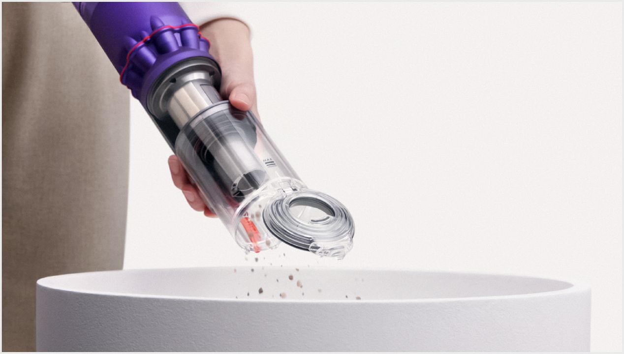 Dyson Omni-glide vacuum ejecting dust into the bin