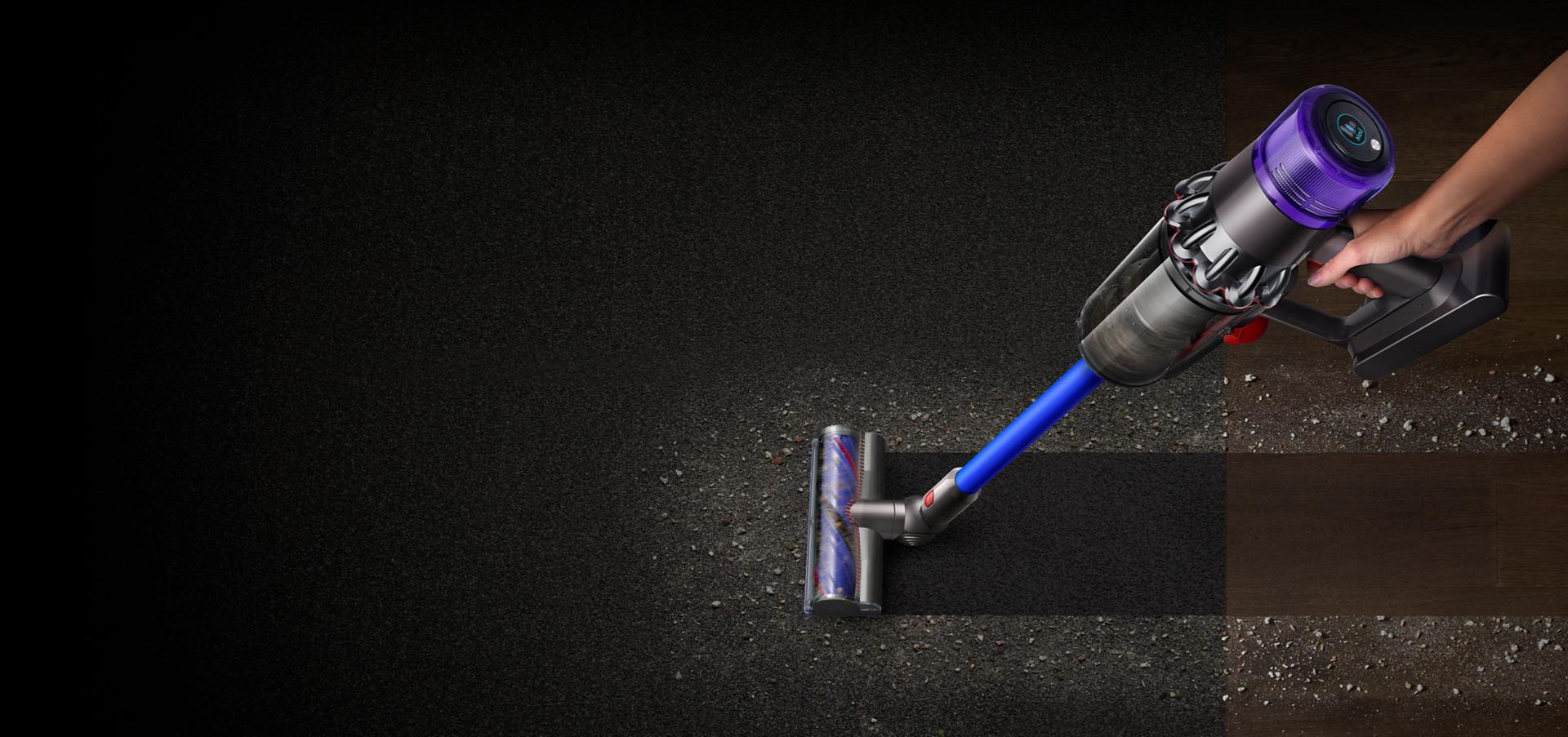 A Dyson V11™ vacuum picking up fine dust, allergens and pollen from the floor.