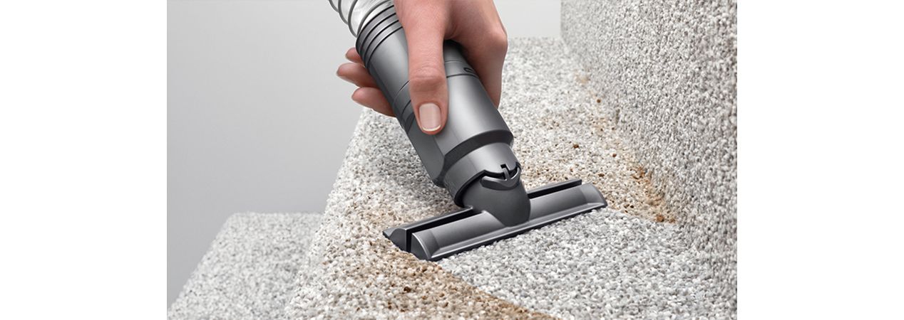 Stair tool being used on dirty staircase