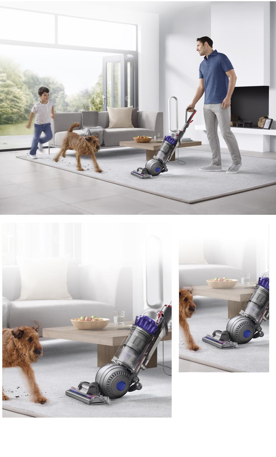 Man, child and dog using Dyson DC66 Animal vacuum cleaner in the living room