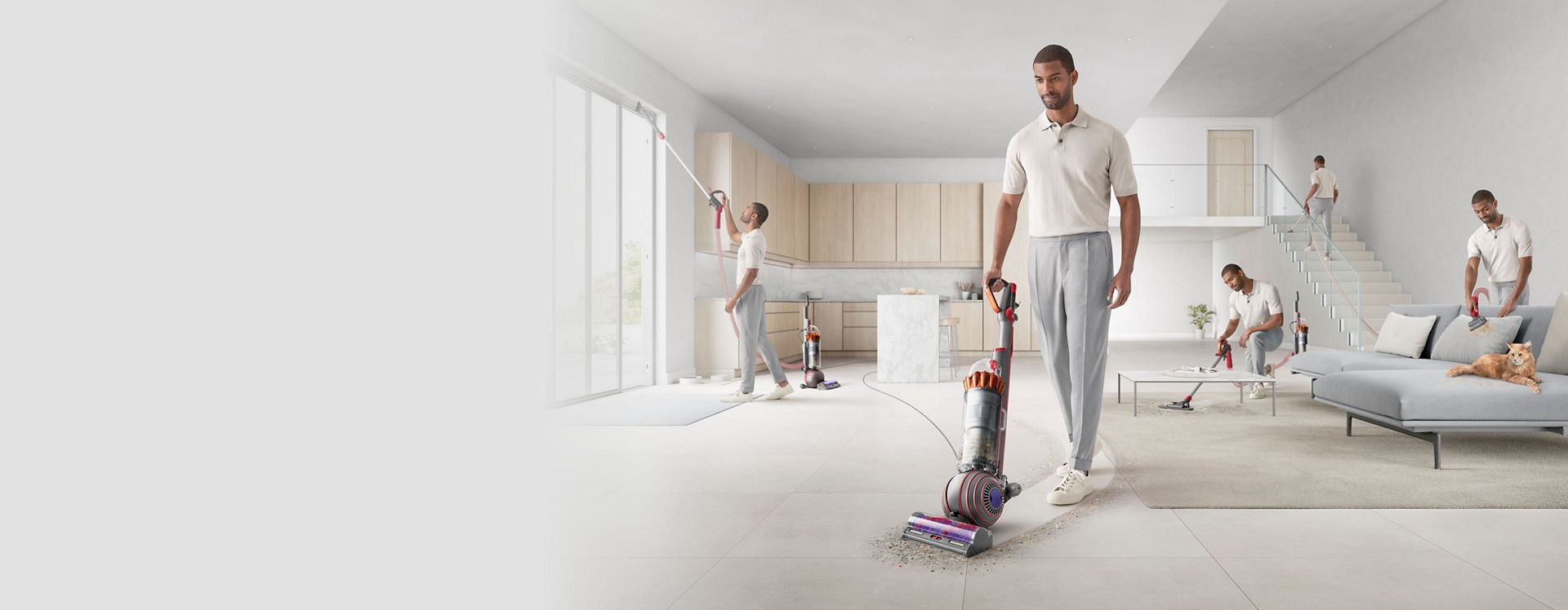 A man cleans his whole house with the Dyson Ball Animal Complete.