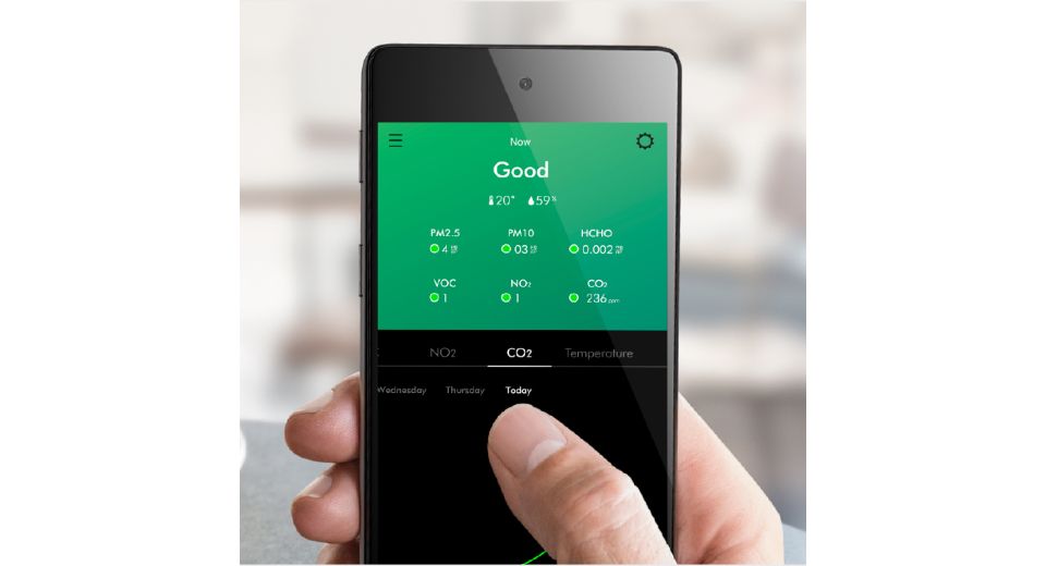 A model using the MyDyson app to monitor their home's air.