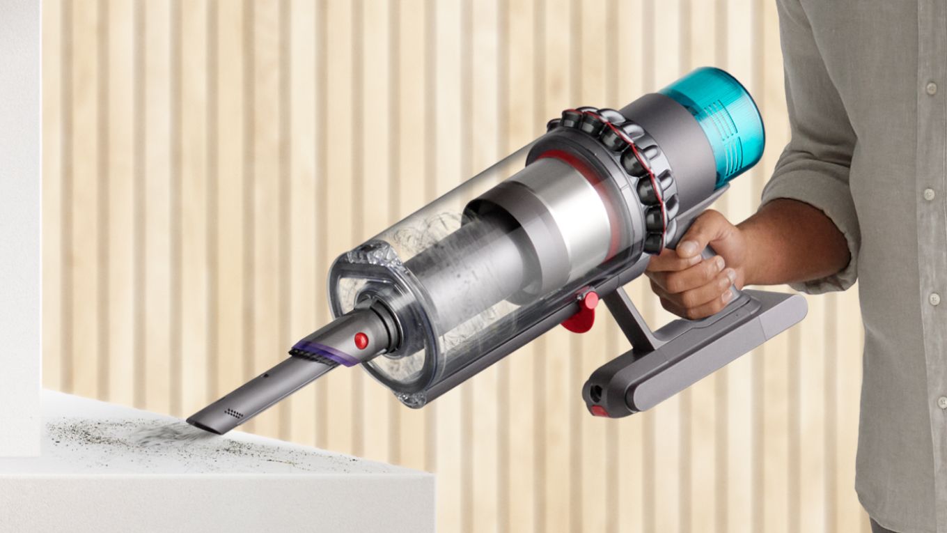 The Dyson Gen5outsize vacuum in handheld mode cleaning a shelf.