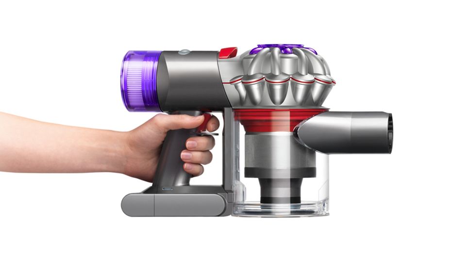 Side view of the body of the Dyson V8 vacuum cleaning up high and down low.