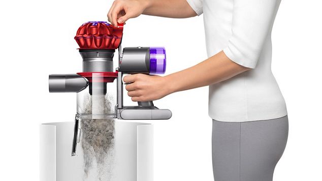 The Dyson V8 Orgin Plus vacuum being emptied in a bin.