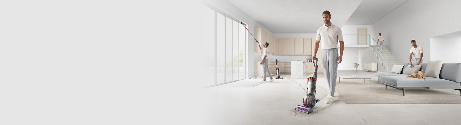 A man cleans his whole house with the Dyson Ball Animal Complete.