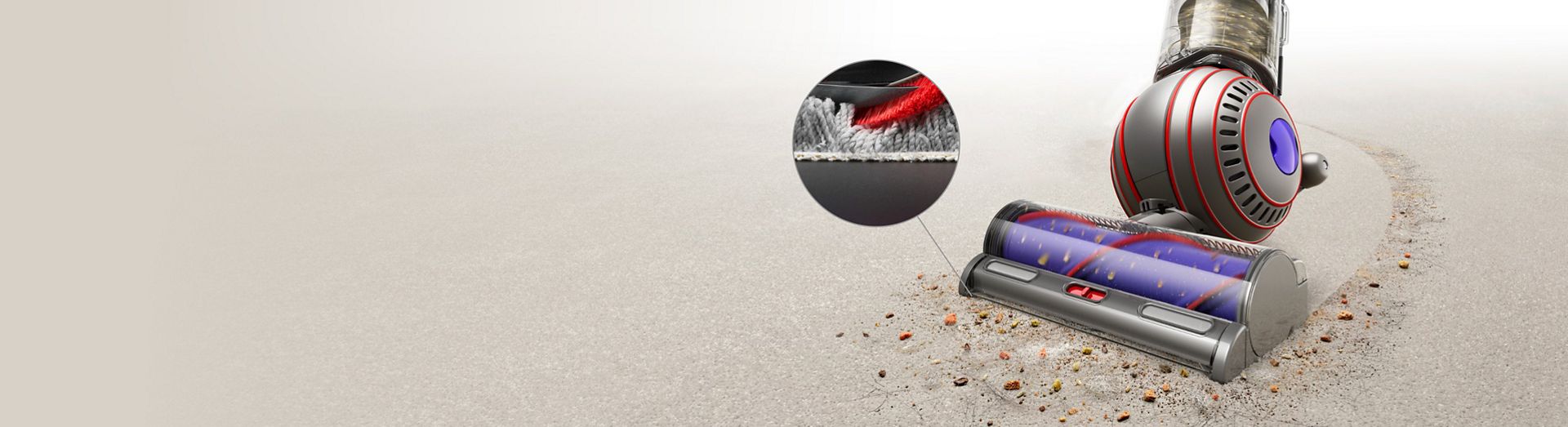 Close-up of the Dyson Ball Animal Complete vacuuming carpet, with detail close-up of carpet fibres.