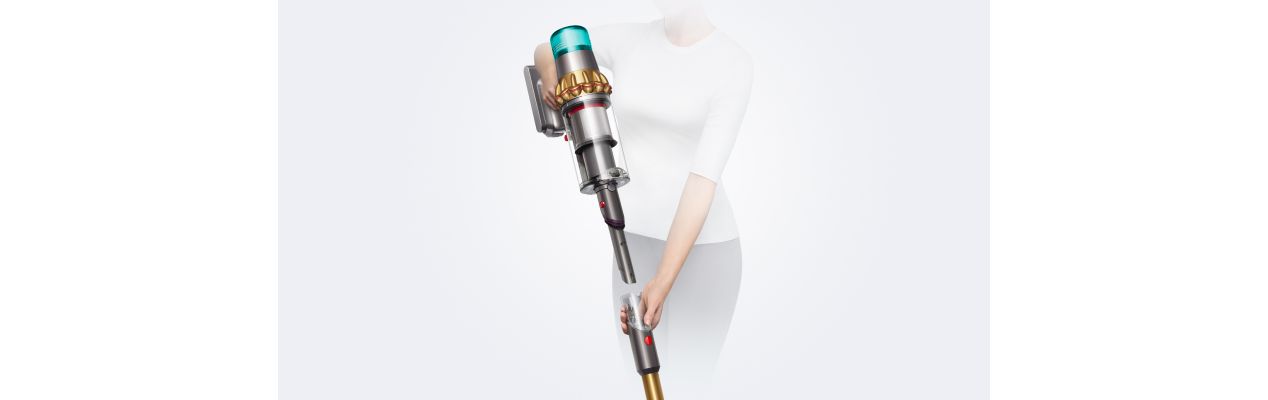 The wand on the Dyson V15 Detect vacuum detaching to reveal the Built-in dusting and crevice tool.