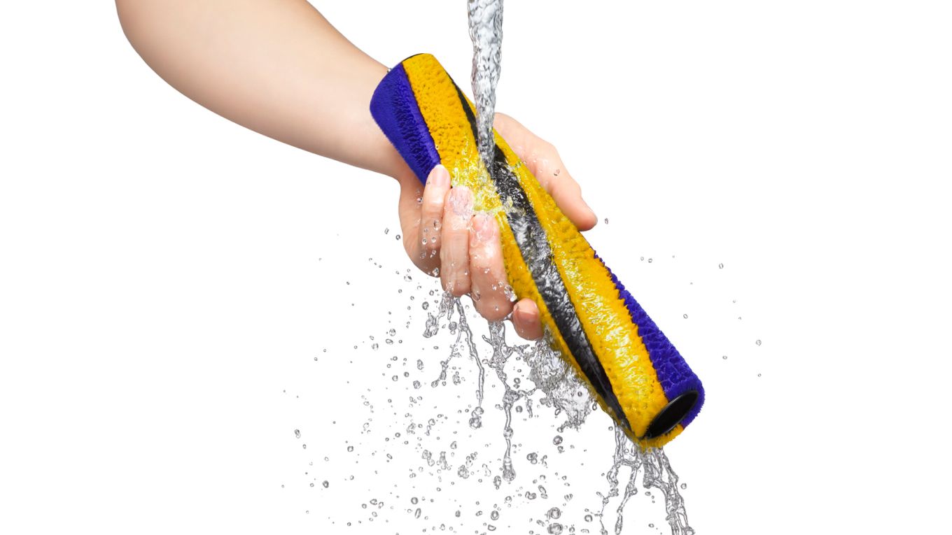 The Dyson V15s Detect Submarine’s brush bar is cleaned under running water.