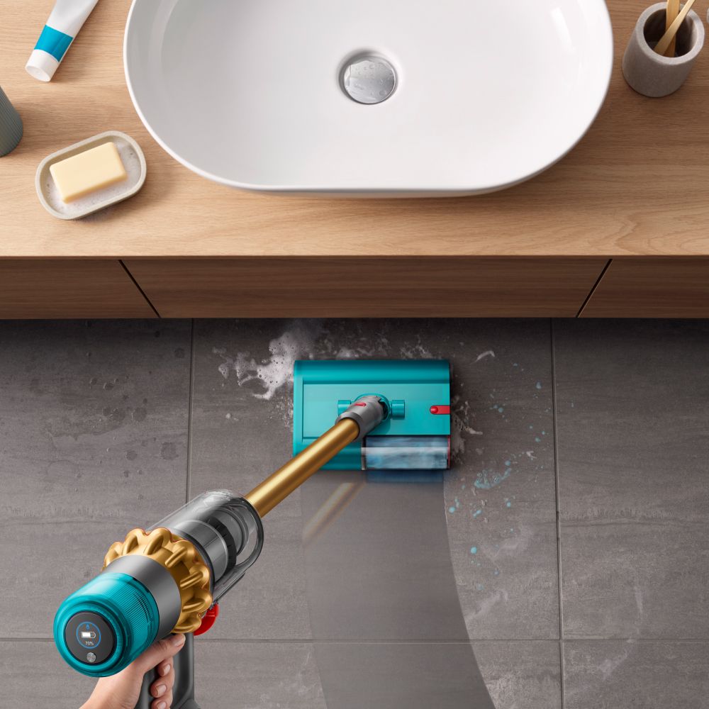 The Dyson V15s Detect Submarine cleans the floor of a bathroom.